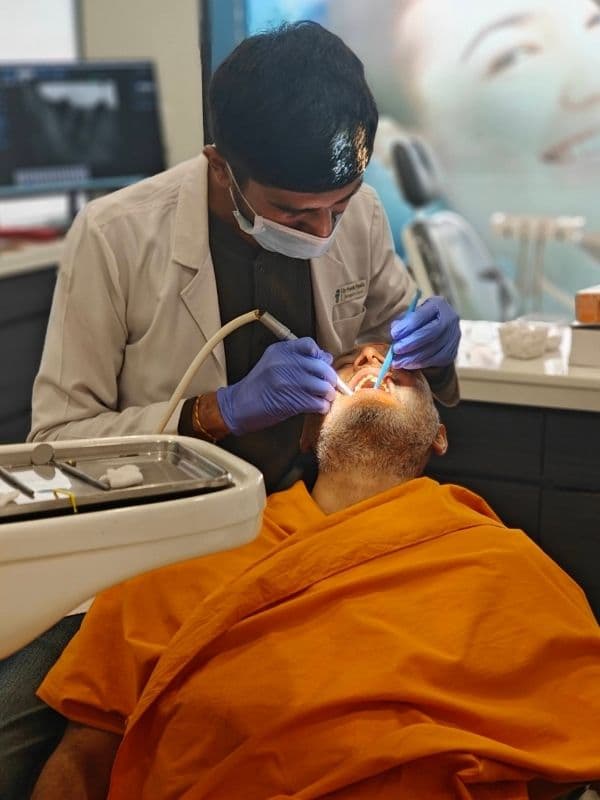 Dr. Pratik Pipalia performing chairside dental implant treatment