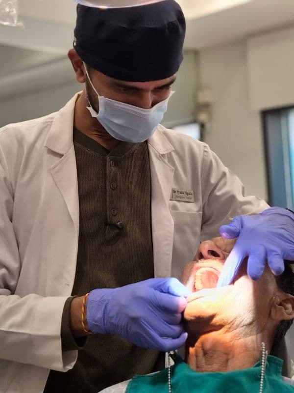 Dr. Pratik Pipalia focused on precision dental implant care