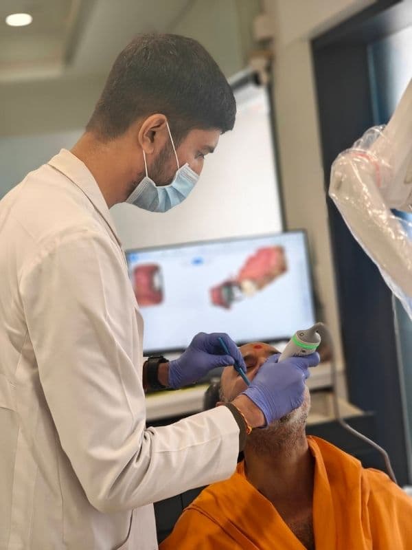 Dr. Pratik Pipalia taking a digital intraoral scan for dental implants