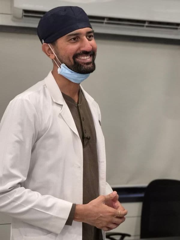 Dr. Pratik Pipalia explaining dental implant treatment planning to a patient